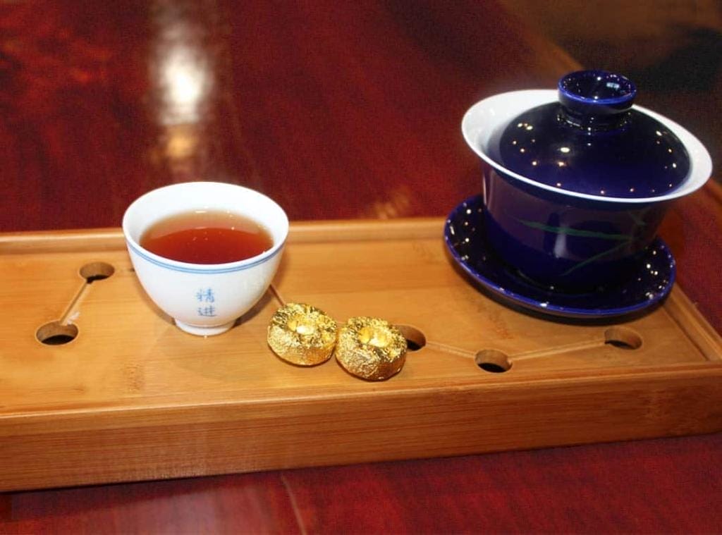 Royal Tea New York's Sticky Rice Tuocha specialty tea brewed on a tea tray