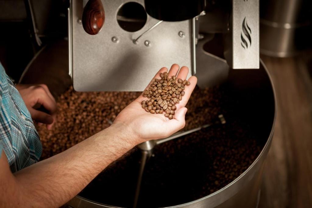 person roasting coffee beans
